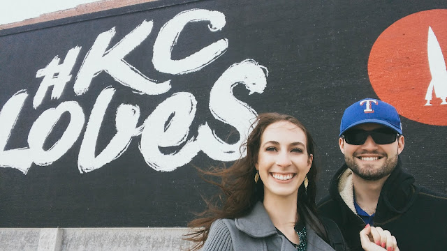 couple poses in front #KCloves mural