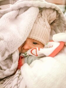 bundled baby on winter trip