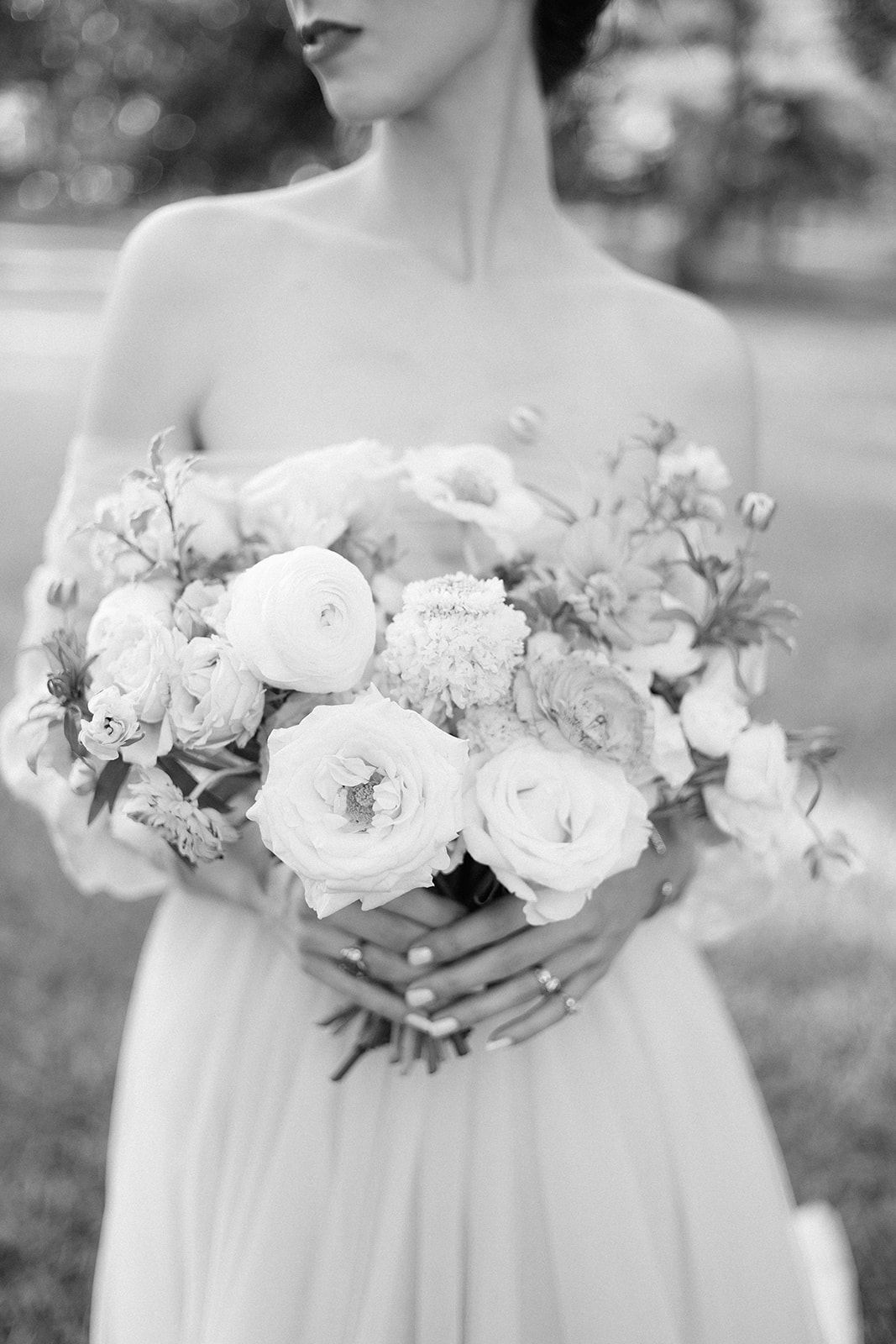 Black & white portrait of bride holding bridal bouquet